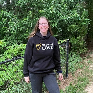 image of person wearing Side with Love Black Hoodie Sweatshirt