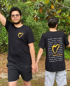 image of 2 people wearing Black Side with Love Adult T Shirt, front and back