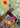 grasped hands lifting person towards an abstract sun