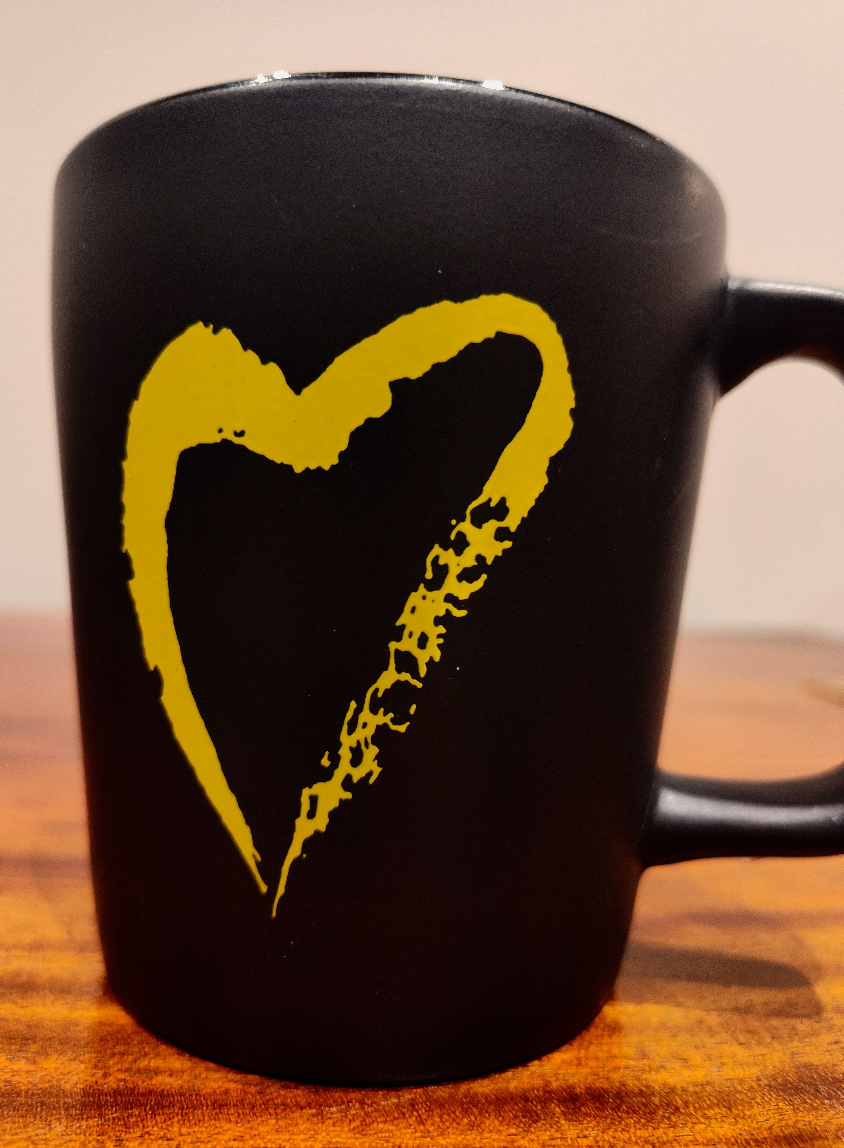 image of Side With Love Black Mug with  Yellow Heart 