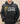 Person wearing a black hoodie with 'SIDE WITH LOVE' and a yellow heart design.